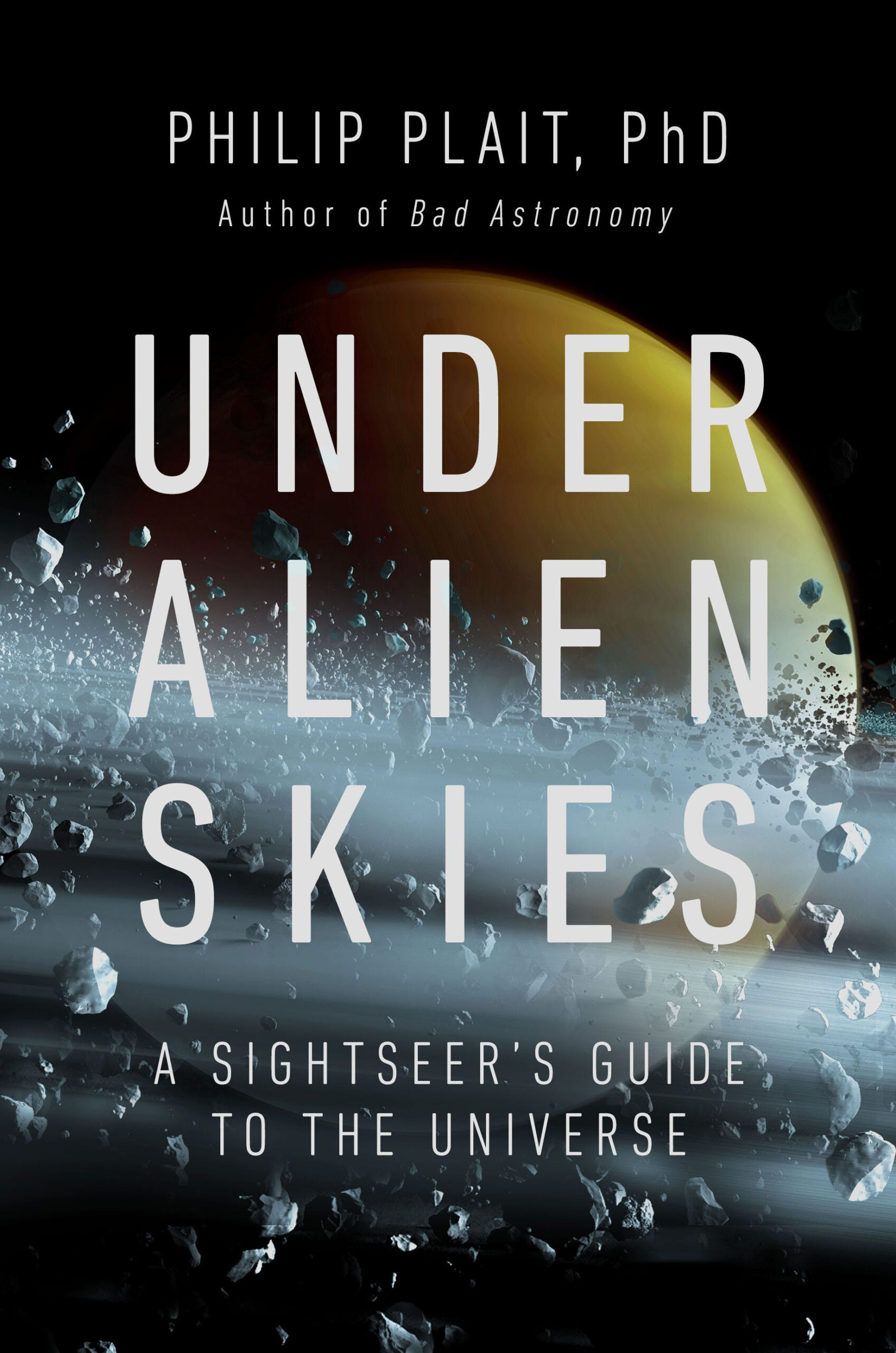 Book cover for Under Alien Skies by Phil Plait, a planet and asteroids floating in space.